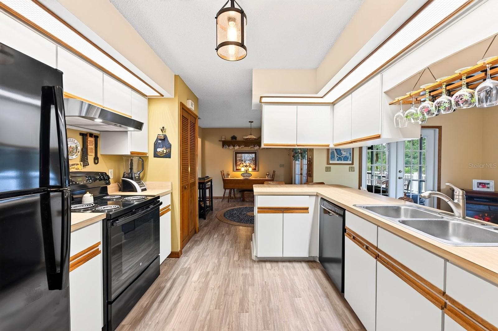 The large Kitchen offers an ABUNDANCE OF CABINETRY and counter space. - 2163 NEWMARK DR, DELTONA