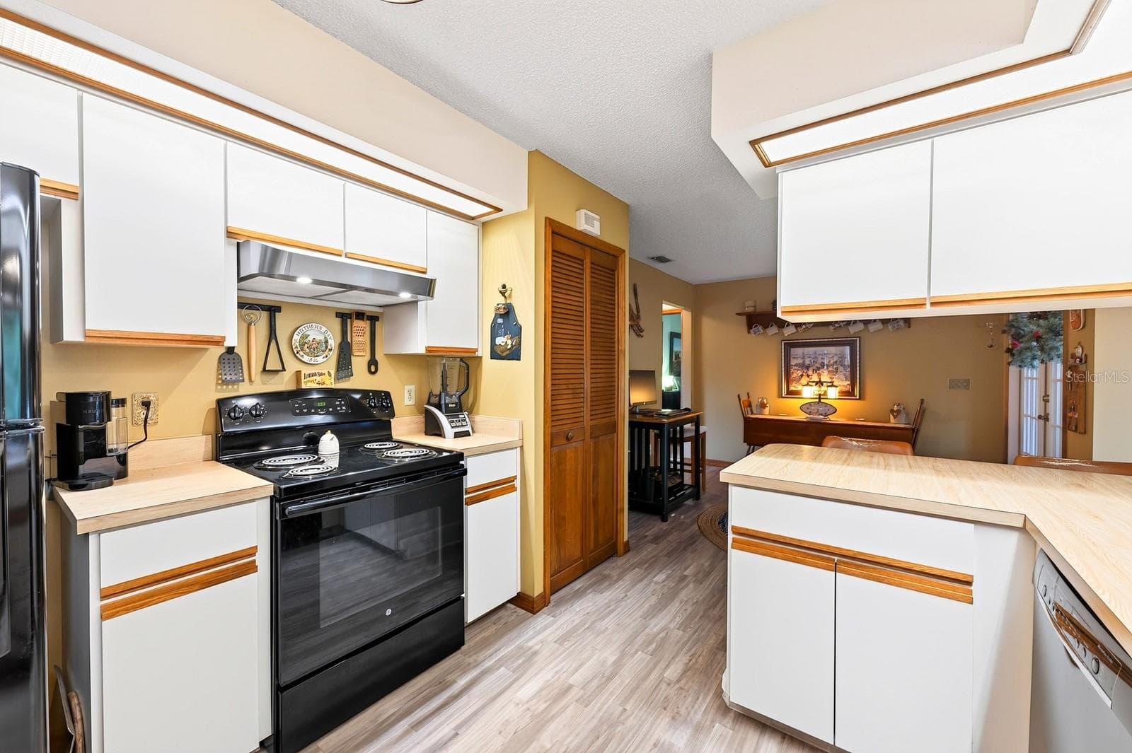 The large Kitchen offers an ABUNDANCE OF CABINETRY and counter space. - 2163 NEWMARK DR, DELTONA