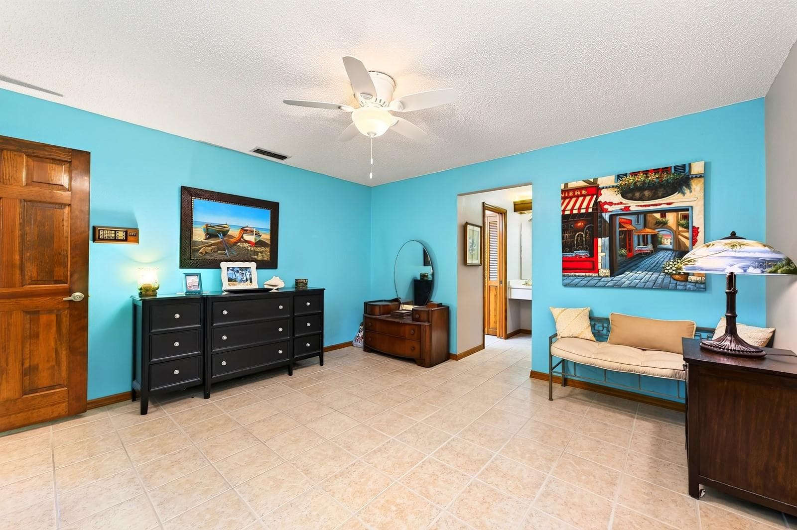 The SPLIT-BEDROOM FLOOR PLAN provides added privacy with the Primary Bedroom featuring a GENEROUS WALK-IN CLOSET and an en suite Bath. - 2163 NEWMARK DR, DELTONA