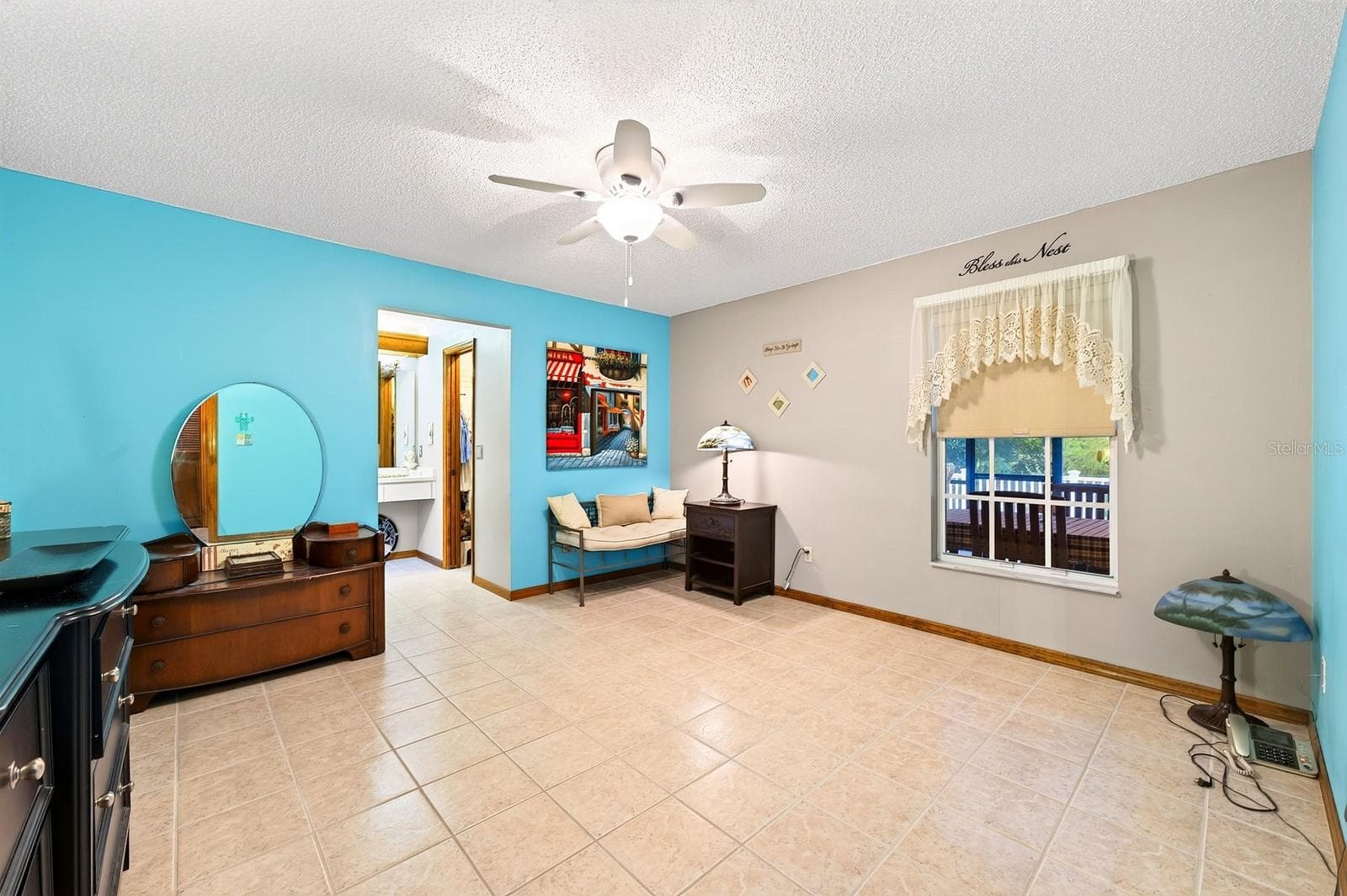 The SPLIT-BEDROOM FLOOR PLAN provides added privacy with the Primary Bedroom featuring a GENEROUS WALK-IN CLOSET and an en suite Bath. - 2163 NEWMARK DR, DELTONA