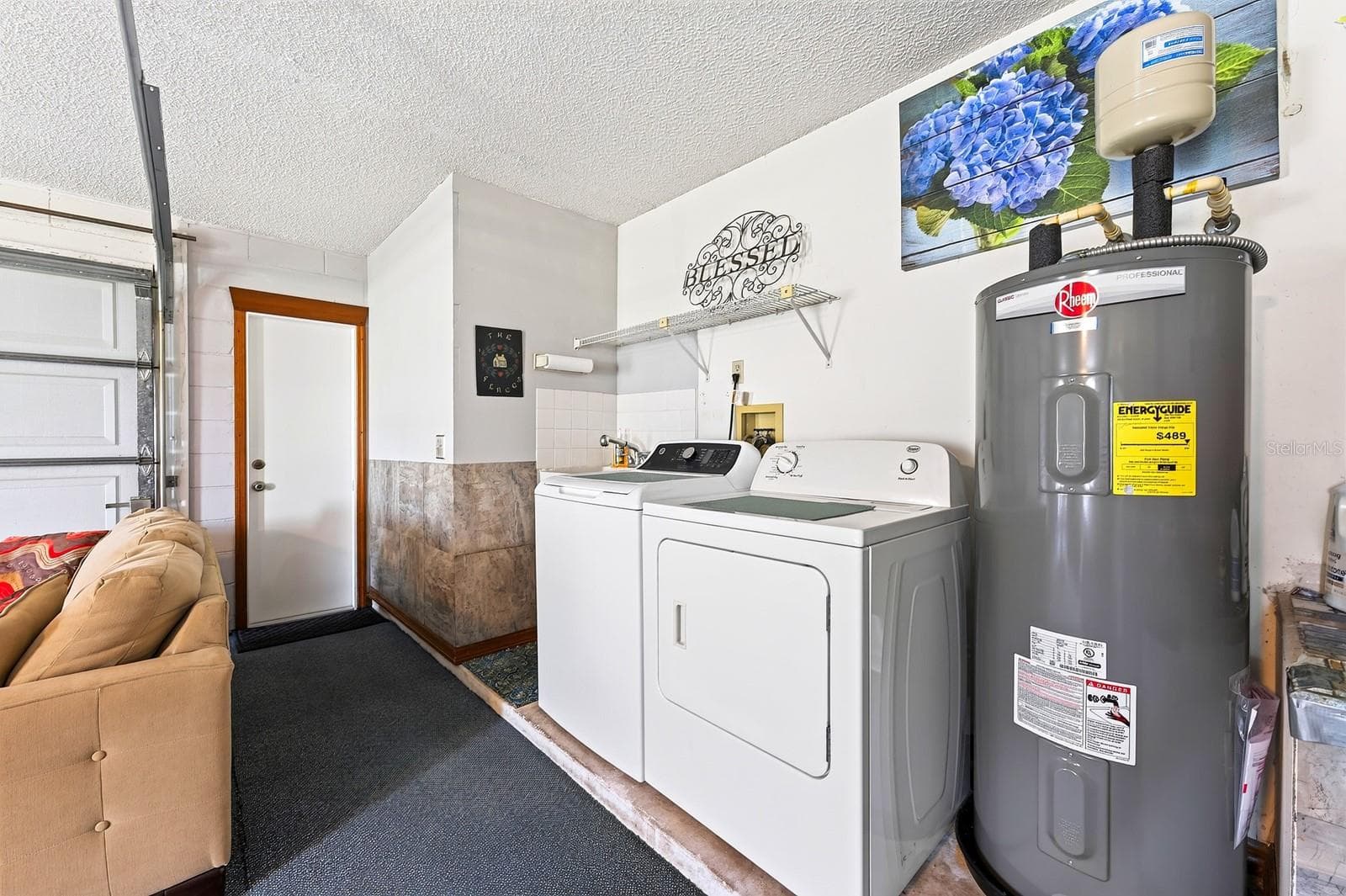 The washer and dryer are housed in the garage. - 2163 NEWMARK DR, DELTONA