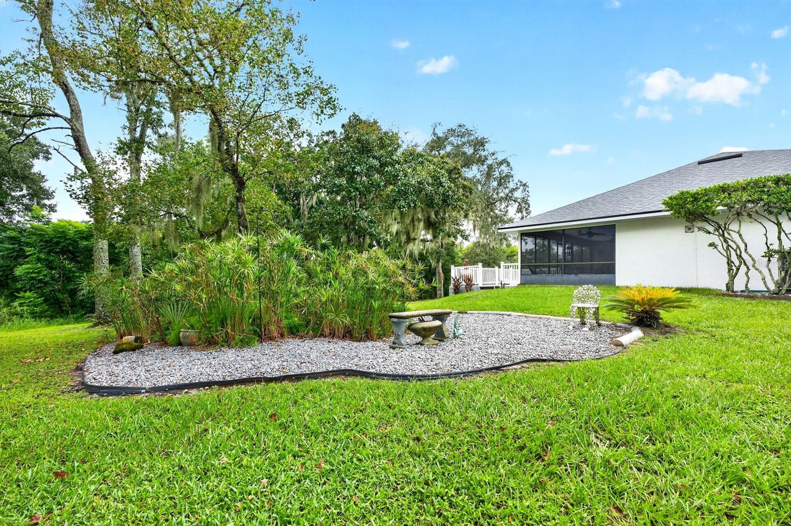 A small GARDEN AREA along the side yard even has its own ELECTRICAL OUTLET, adding convenience for gardening projects or other outdoor uses. - 2163 NEWMARK DR, DELTONA