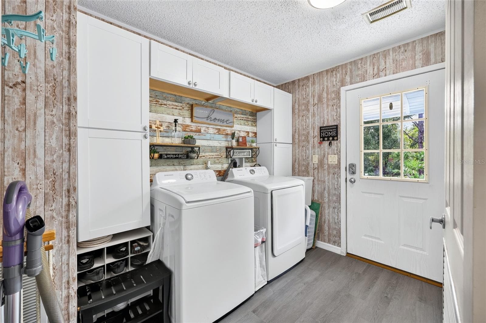 Interior laundry room with rear access from the parking pad - 12647 SE 102ND AVE, BELLEVIEW