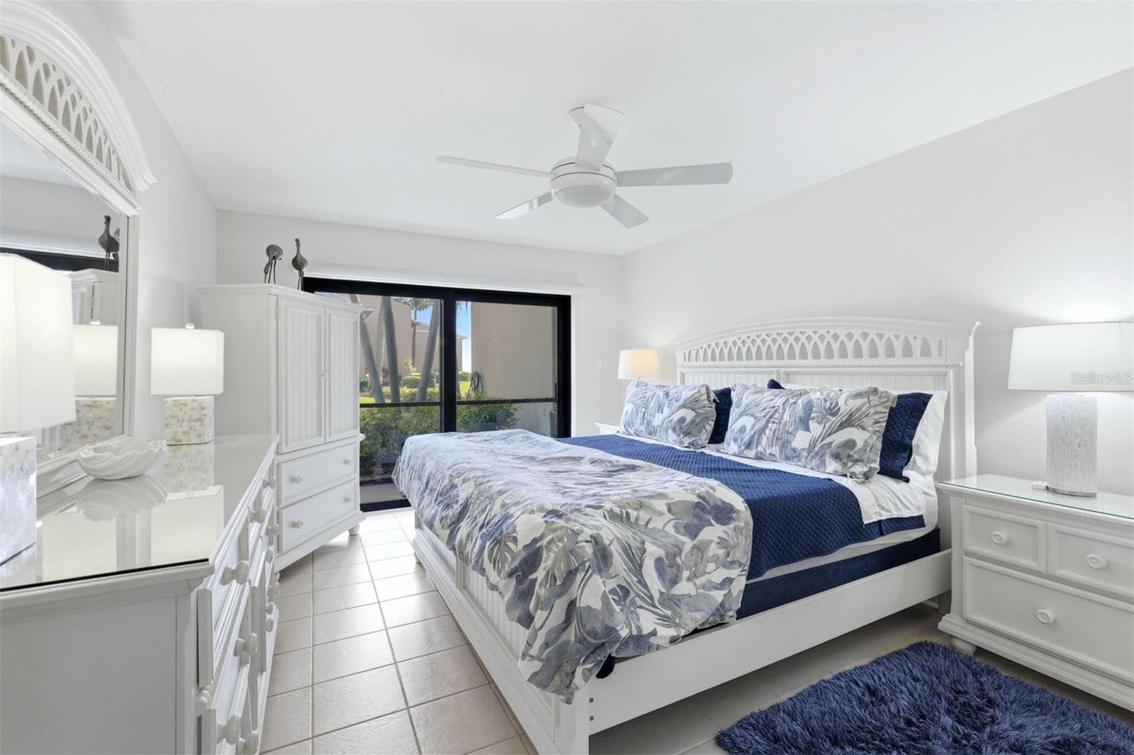 Primary bedroom with impact rated slider to lanai - 5655 GULF OF MEXICO DR #A107, LONGBOAT KEY