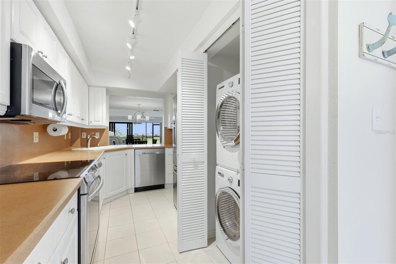 Kitchen with washer/dryer - 5655 GULF OF MEXICO DR #A107, LONGBOAT KEY