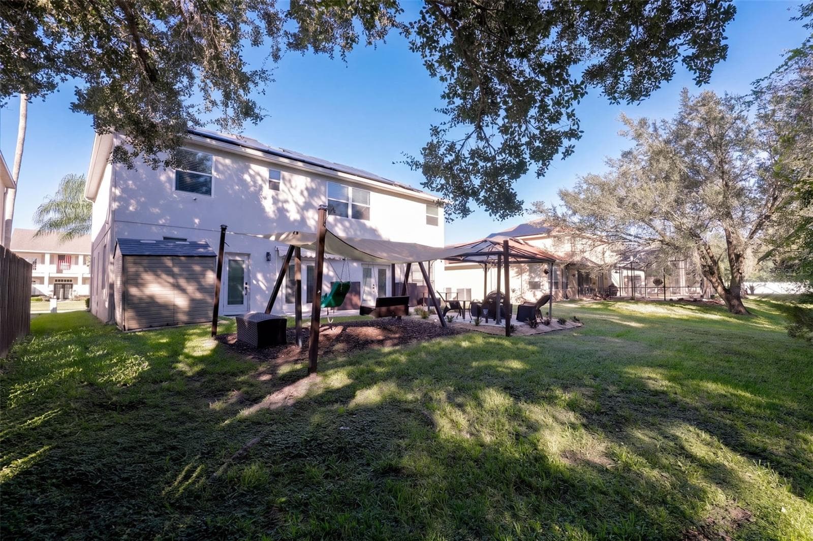 Back yard with swing set - 10603 SUNRISE TERRACE DR, ORLANDO