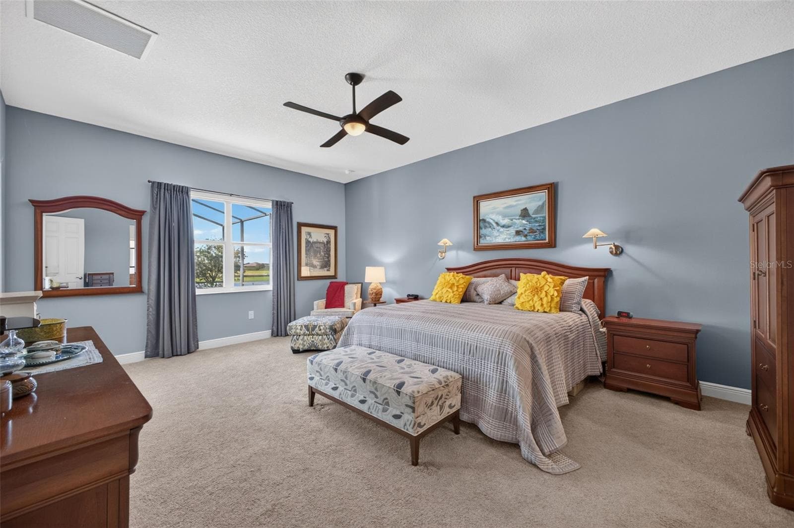 Bright, airy, and exceptionally spacious, this primary retreat features generous dual walk-in closets and a beautifully appointed en-suite bathroom. - 2444 PAWTUCKET PASS, MOUNT DORA