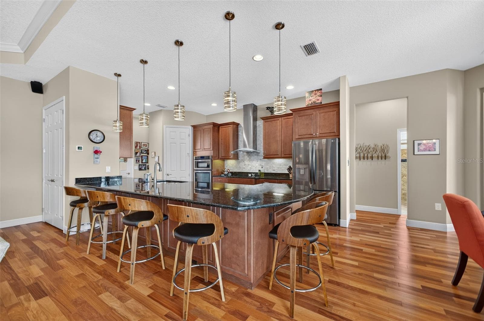 Stylish pendant lights illuminate and accent the spacious kitchen peninsula. - 2444 PAWTUCKET PASS, MOUNT DORA