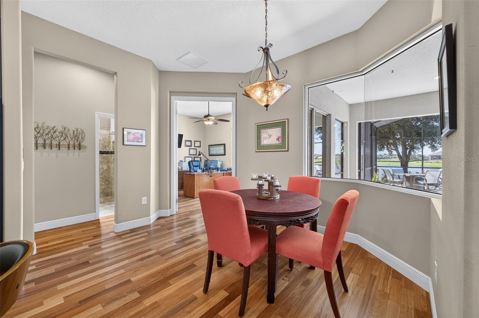 The cozy breakfast room offers a charming nook to enjoy morning coffee accompanied by serene lake views. - 2444 PAWTUCKET PASS, MOUNT DORA