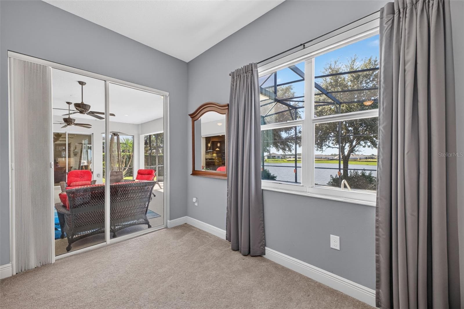 Step straight from your private primary sanctuary onto the sunlit lanai and pool deck via large sliding glass doors. - 2444 PAWTUCKET PASS, MOUNT DORA