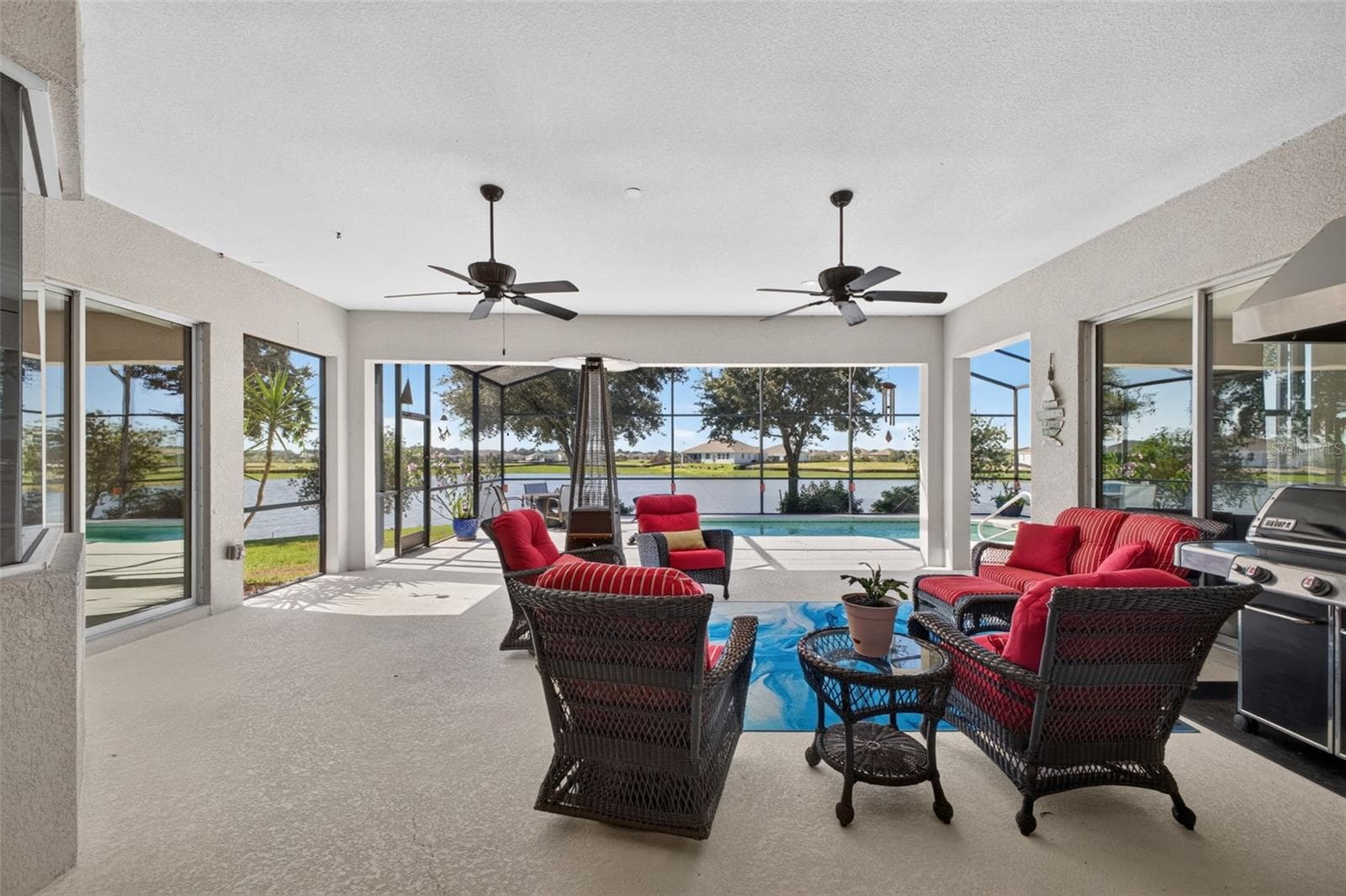 The lanai is spacious and has plenty of space in the shade, with easy access to the pool and sunshine. - 2444 PAWTUCKET PASS, MOUNT DORA