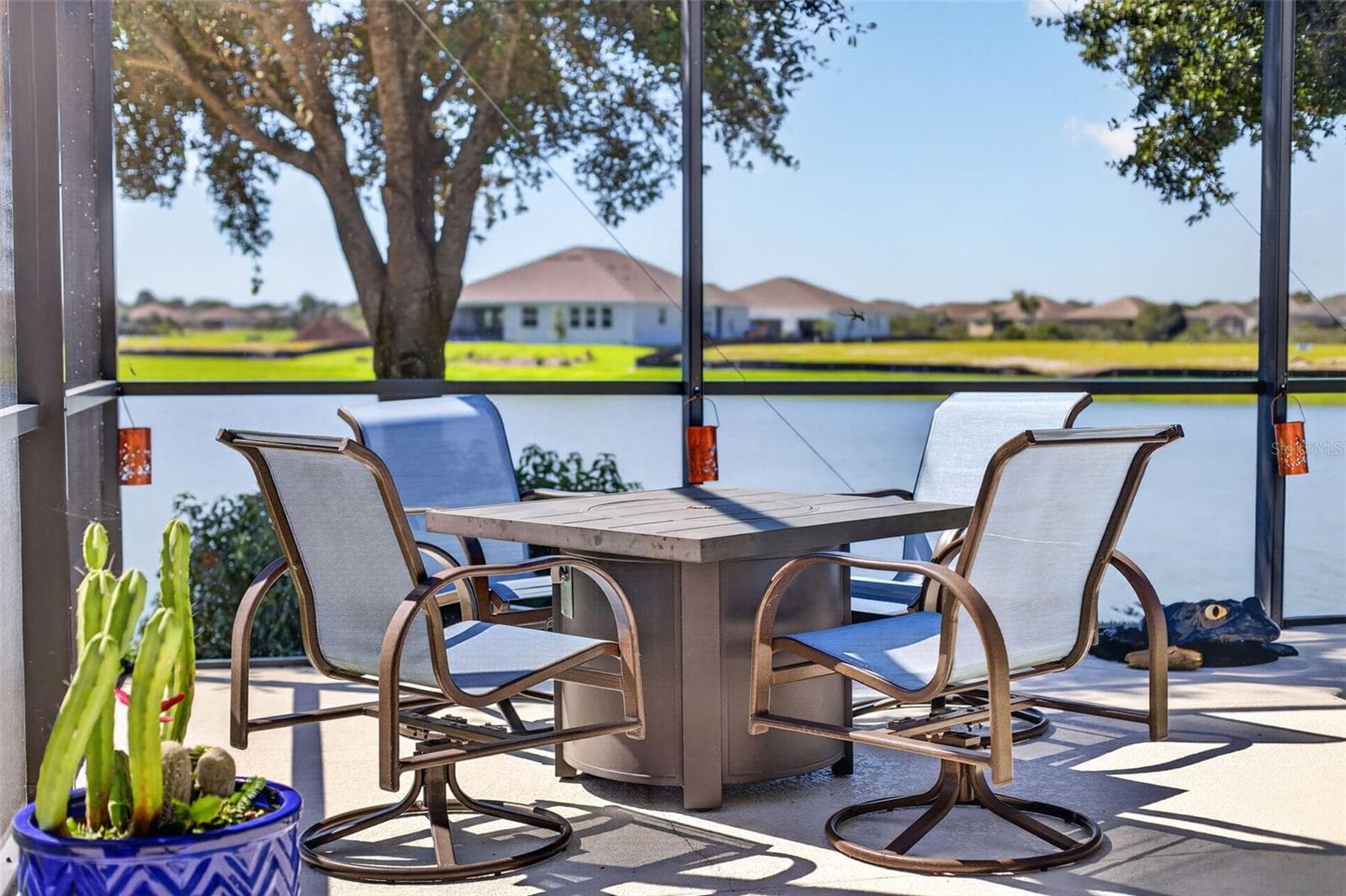 Bring your outdoor fireplace—you’re going to love spending crisp evenings by the pool and lake! - 2444 PAWTUCKET PASS, MOUNT DORA