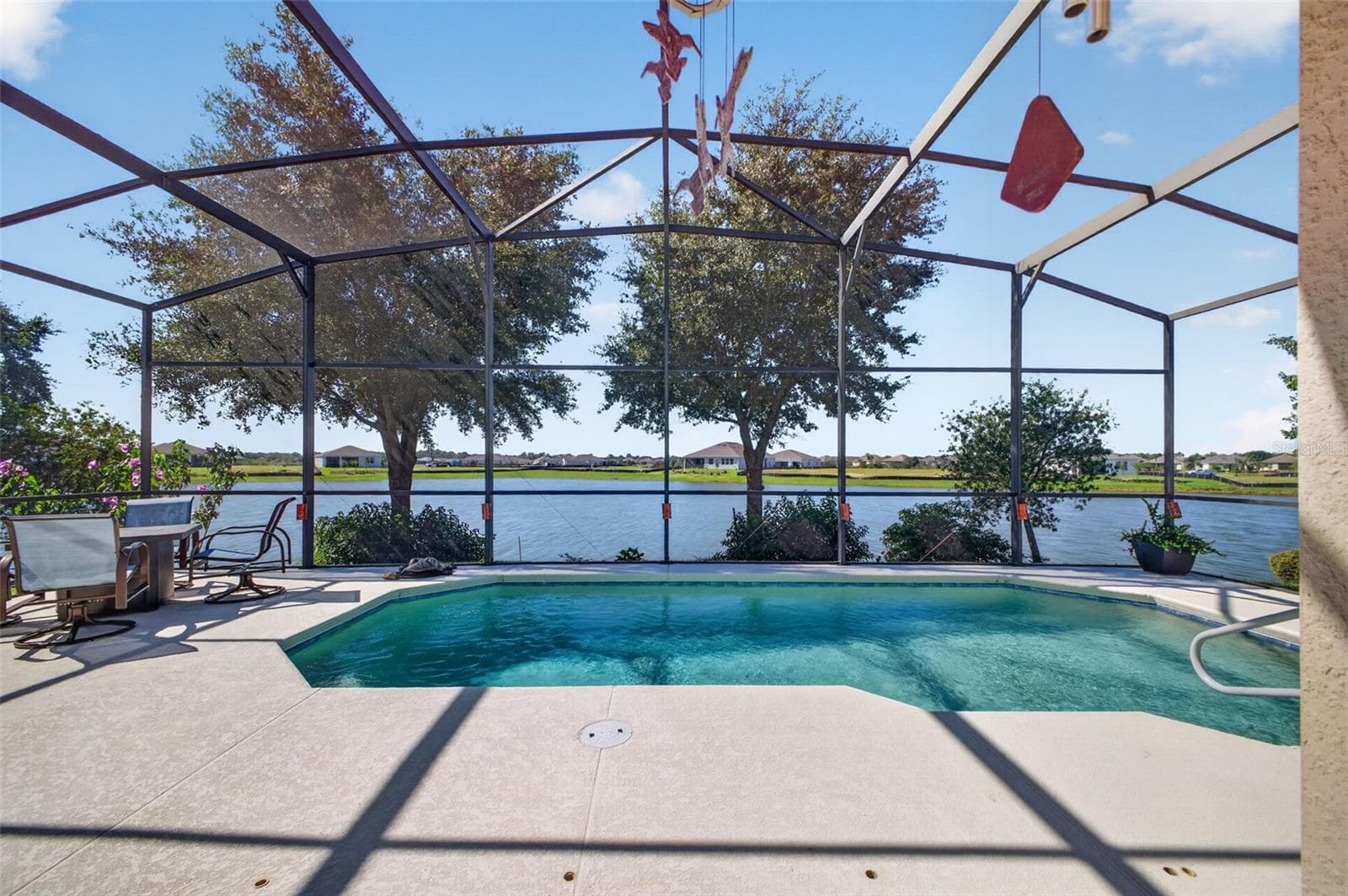 Take a refreshing dip in the pool while taking in the vibrant waterfront activity on the lake. - 2444 PAWTUCKET PASS, MOUNT DORA