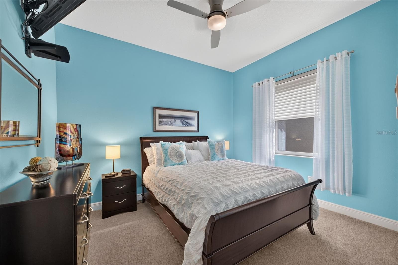 A bright and welcoming retreat, this third bedroom offers generous proportions to comfortably accommodate overnight guests in style. - 2444 PAWTUCKET PASS, MOUNT DORA