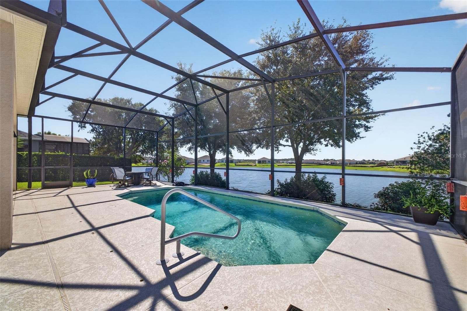 Expanded for maximum outdoor enjoyment, the generous lanai and patio create a seamless backyard oasis built for effortless relaxation and entertaining. - 2444 PAWTUCKET PASS, MOUNT DORA