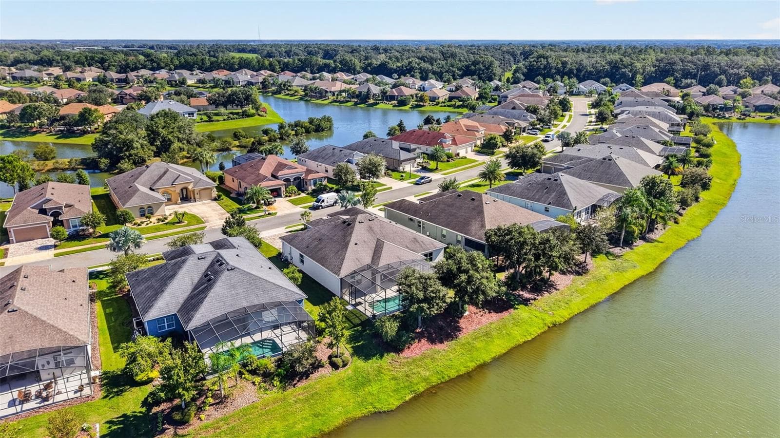 An impressive aerial perspective of the premier waterfront homes situated along peaceful Pawtucket Pass. - 2444 PAWTUCKET PASS, MOUNT DORA