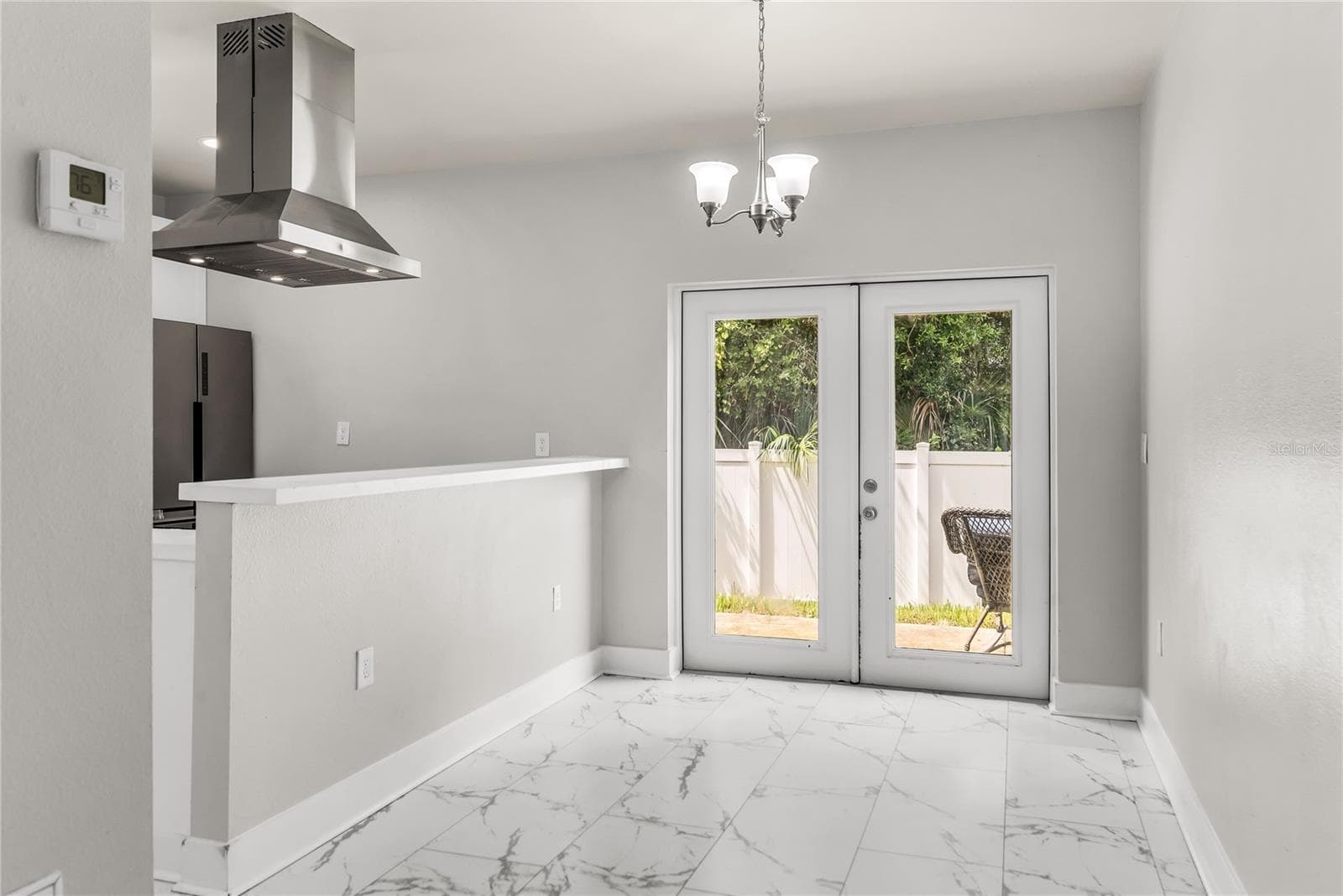 Dining Room with French doors leads to patio and fully fenced in back yard - 3954 S SANFORD AVE, SANFORD