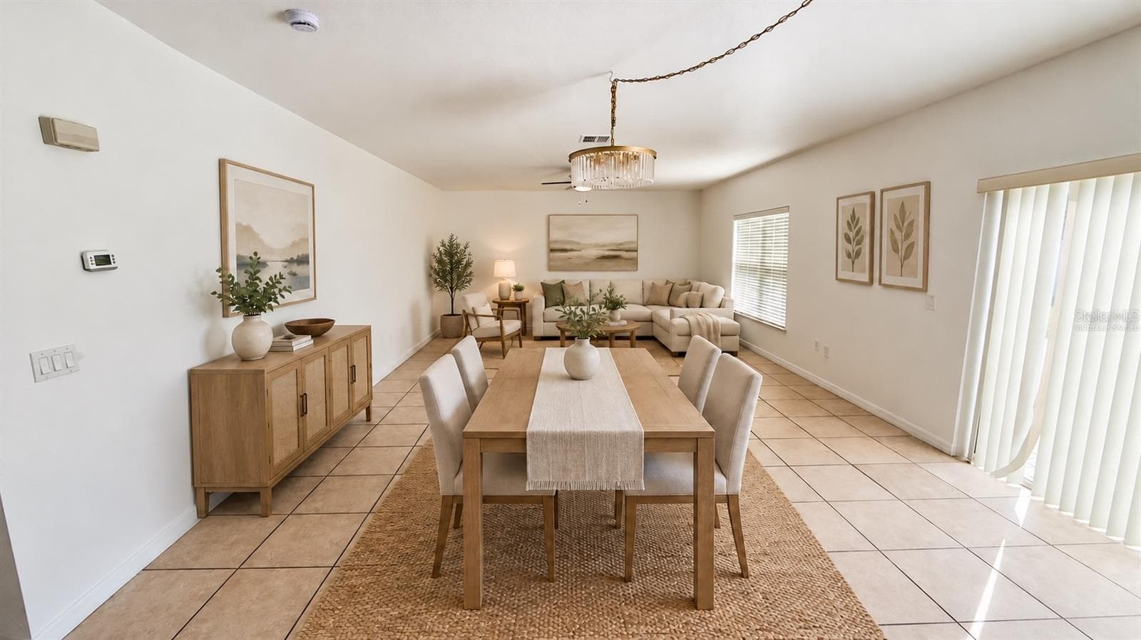 Virtually staged - Living and dining area. Digital furniture and decor illustrate a possible layout; furnishings are not included. Original unstaged view retained in this gallery. - 2255 SHEBOYGAN PL, KISSIMMEE