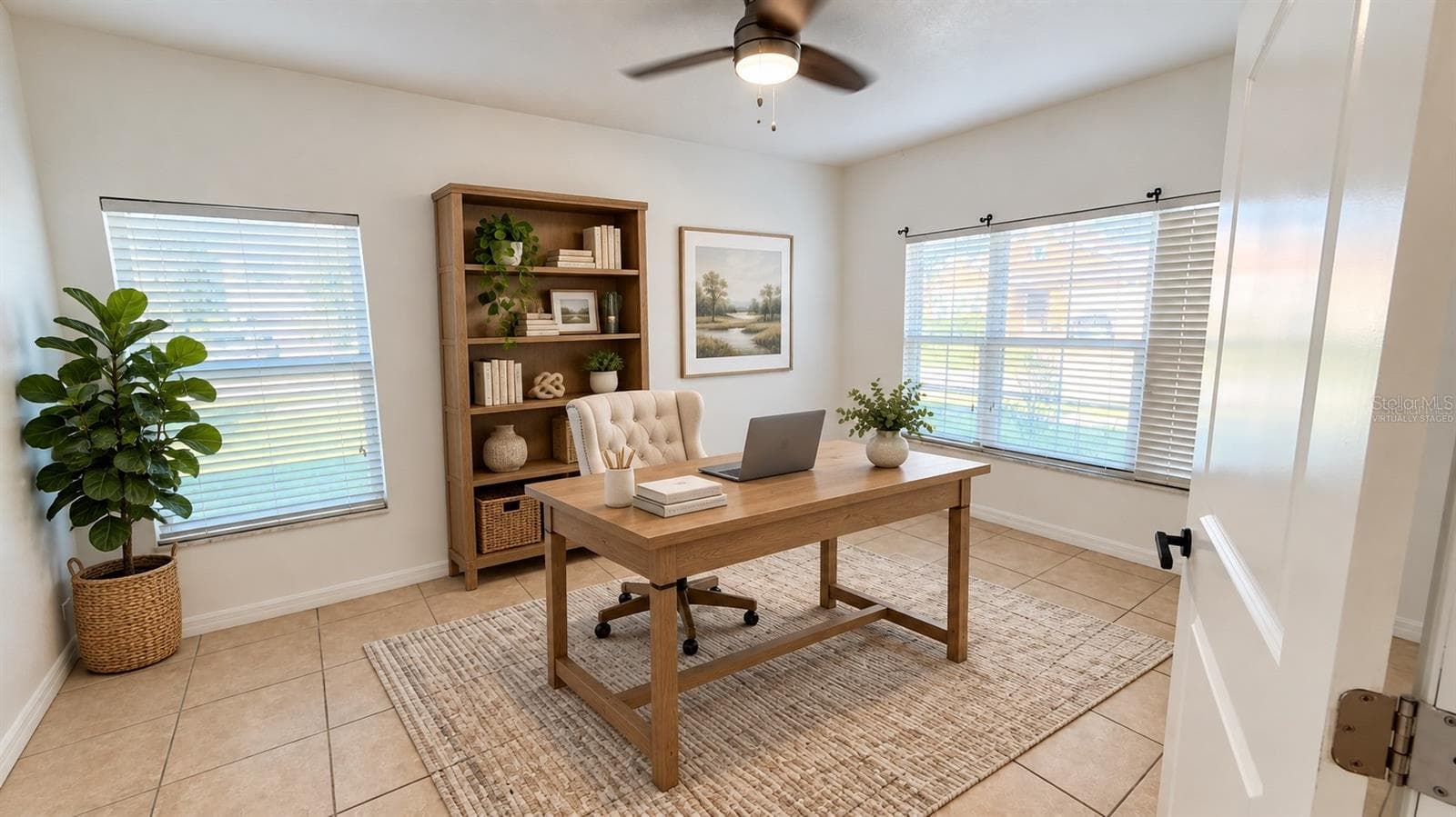 Virtually staged - First-floor study shown as a home office. Digital desk, chair and decor; furnishings are not included. Original unstaged view included. - 2255 SHEBOYGAN PL, KISSIMMEE