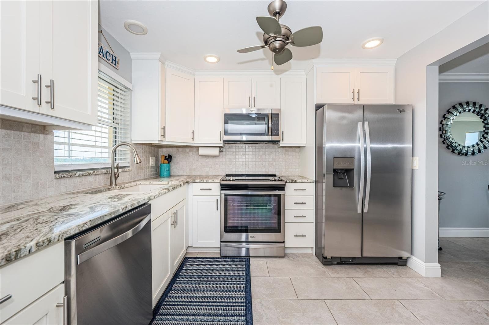 Completely updated kitchen with granite counters, stainless appliances, new lighting and much more - 4775 COVE CIR #904, ST PETERSBURG