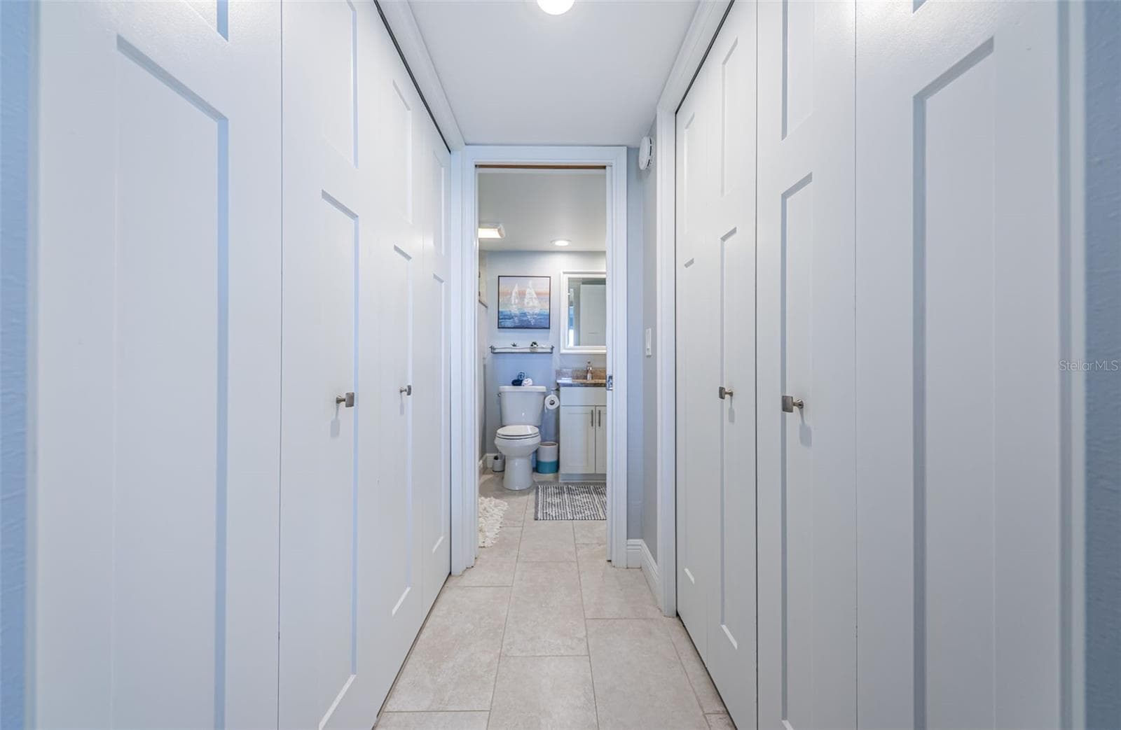 Washer/Dryer closet on the left and walk-in closet to the right - 4775 COVE CIR #904, ST PETERSBURG