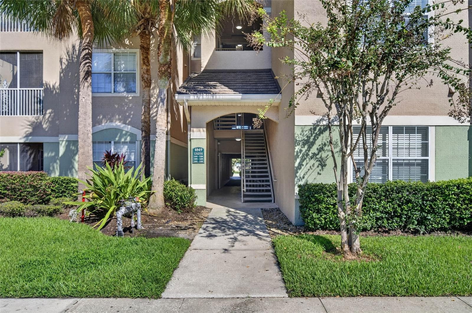 Building entrance and stairwell to third-floor unit - 4849 CYPRESS WOODS DR #1302, ORLANDO