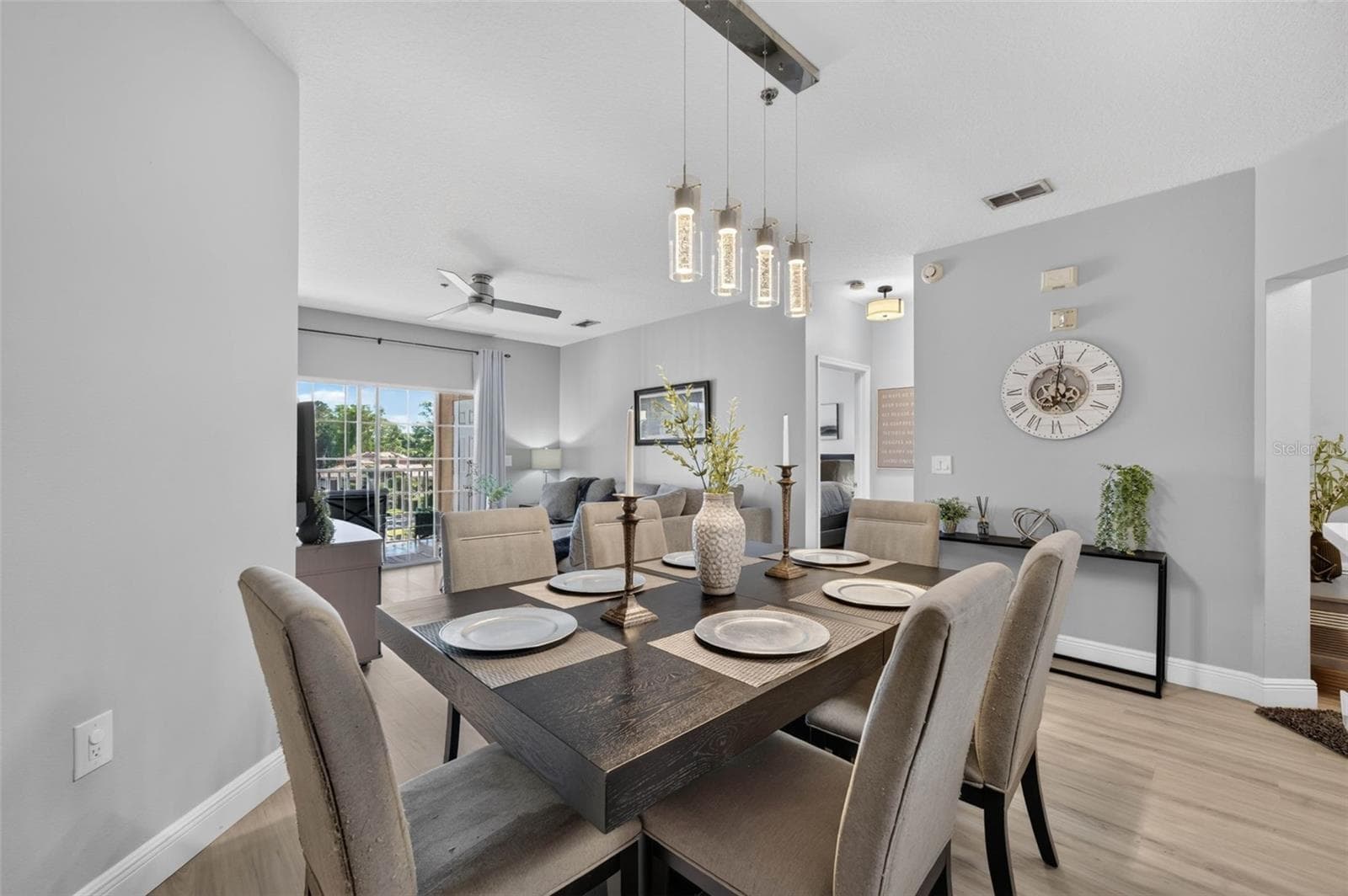 Dining room looking toward living room and balcony - 4849 CYPRESS WOODS DR #1302, ORLANDO