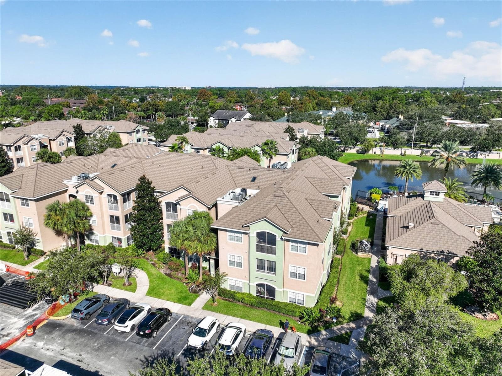 Aerial view of building, grounds and pond - 4849 CYPRESS WOODS DR #1302, ORLANDO