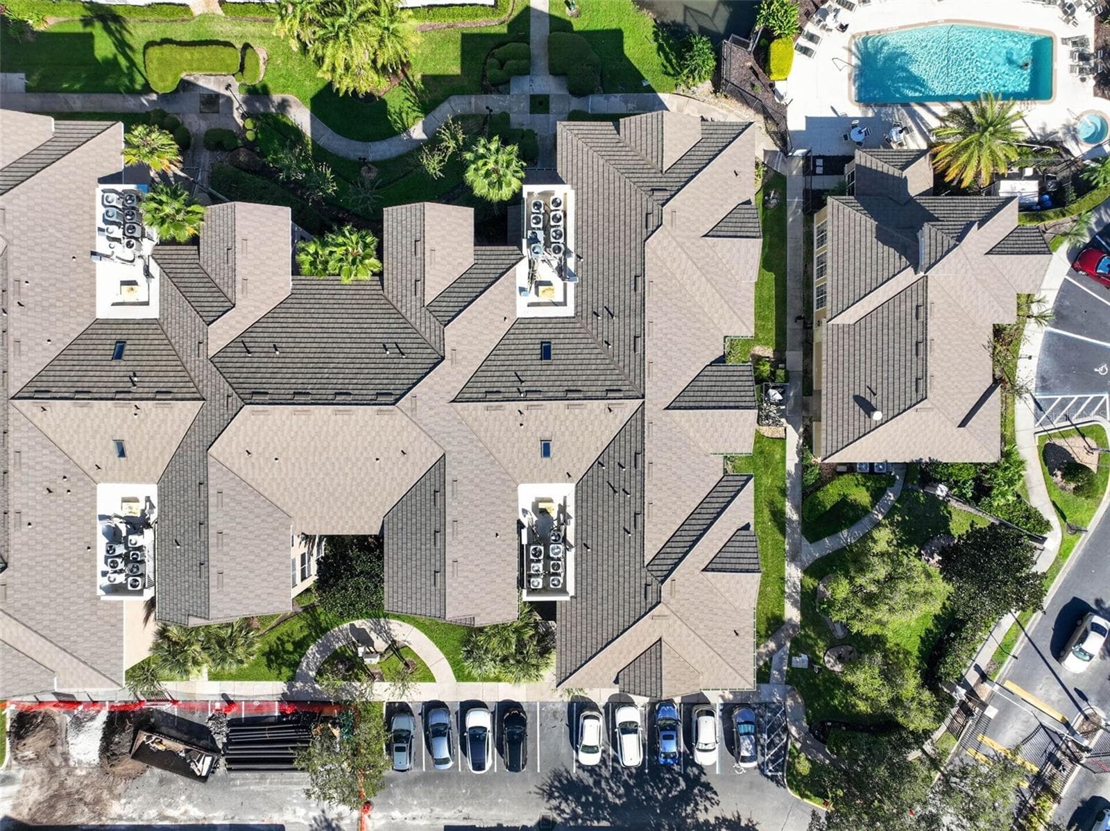 Top-down aerial of tile roof and community pool - 4849 CYPRESS WOODS DR #1302, ORLANDO
