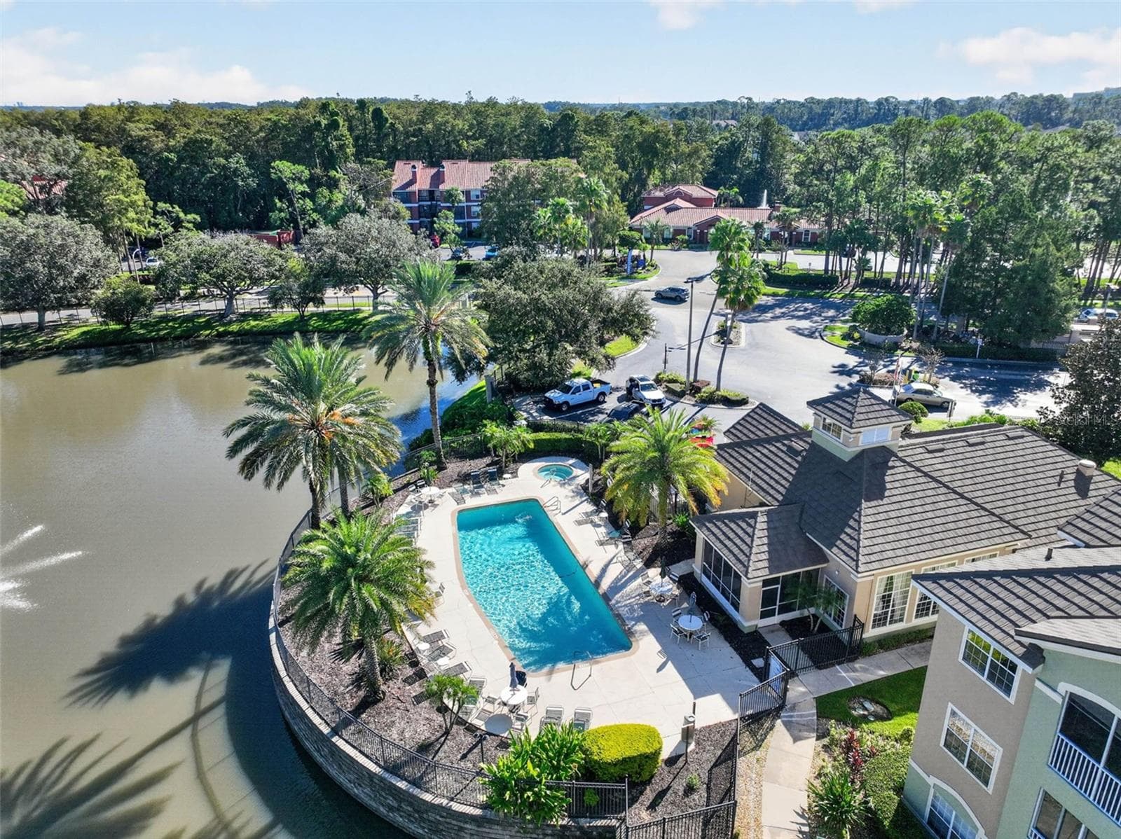 Aerial of clubhouse, community pool and pond - 4849 CYPRESS WOODS DR #1302, ORLANDO