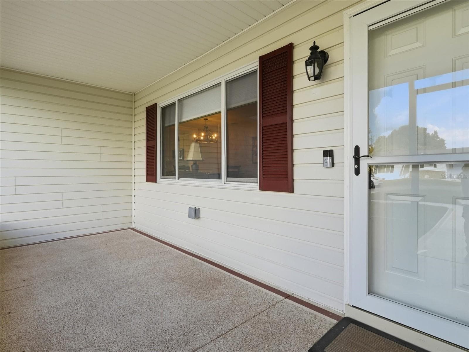Screened Front Porch with Custom Storm Door - 9892 SE 177TH LN, SUMMERFIELD