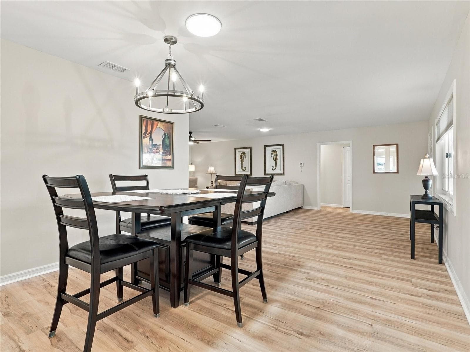 Dining Room with Table for 4 and Solar Tube and New Light Fixture - 9892 SE 177TH LN, SUMMERFIELD