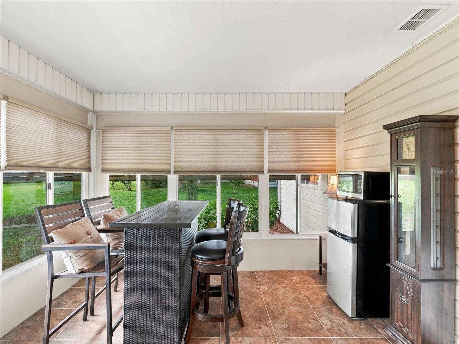 Lanai / Den includes a High Top Table and Fridge/Microwave - 9892 SE 177TH LN, SUMMERFIELD