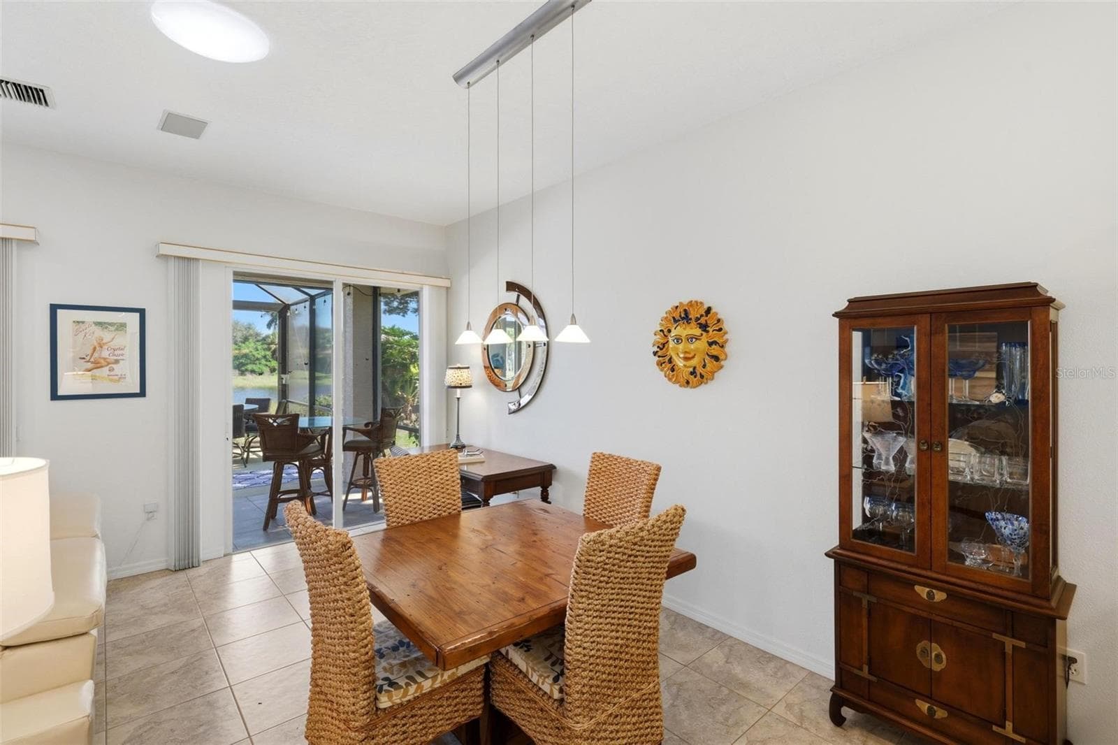 Dining area with lake views - 687 LAKESCENE DR, VENICE