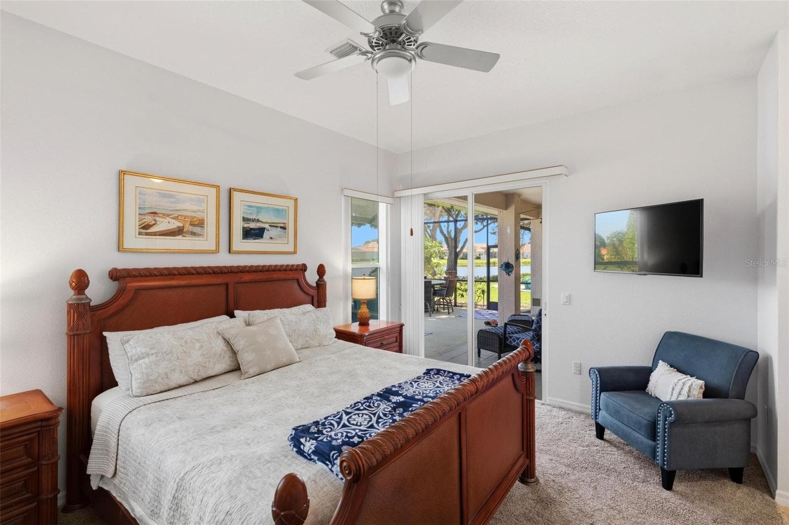 Primary bedroom with access to lanai - 687 LAKESCENE DR, VENICE