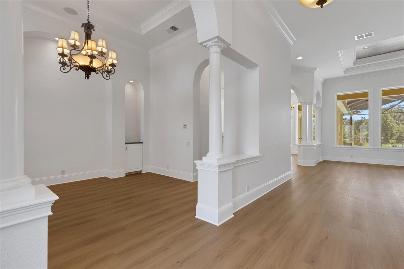 New luxury vinyl plank flooring throughout the first floor and freshly painted from ceiling to baseboards. - 6562 EAGLE VIEW LOOP, LAKELAND