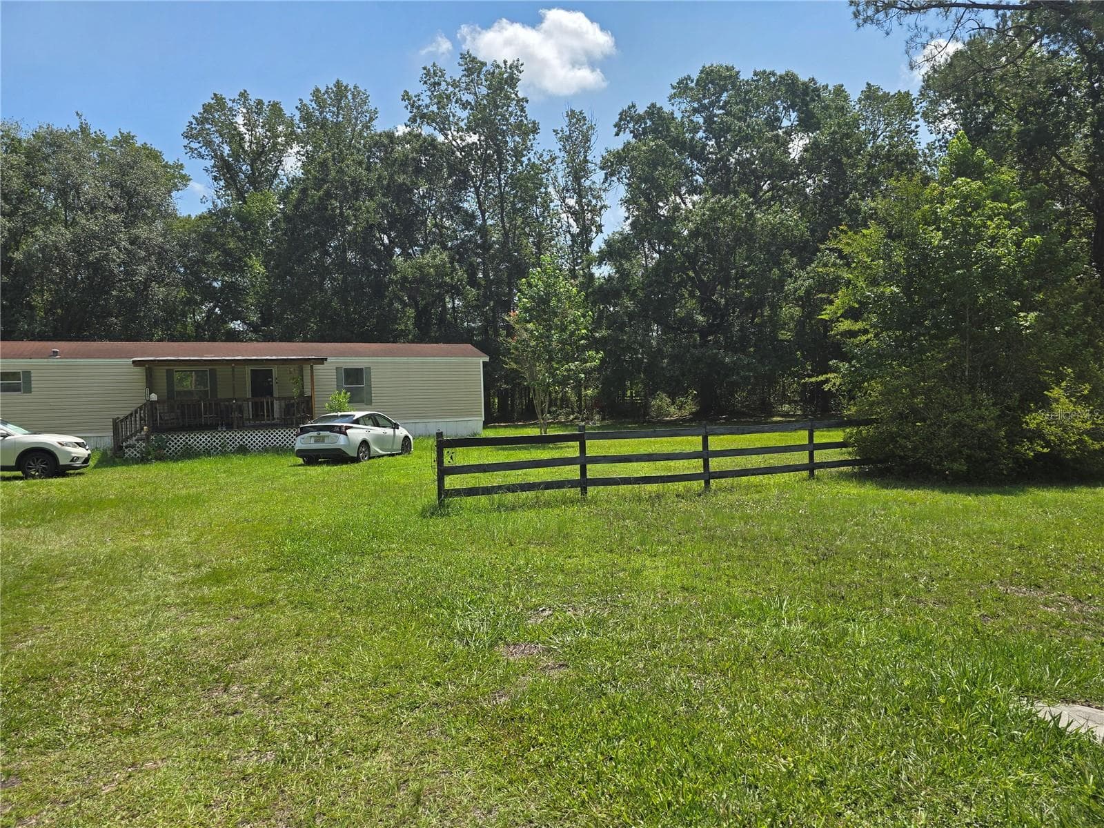 Manufactured Home at 11693 NW COUNTY ROAD 229, LAKE BUTLER, photo 2 of 29