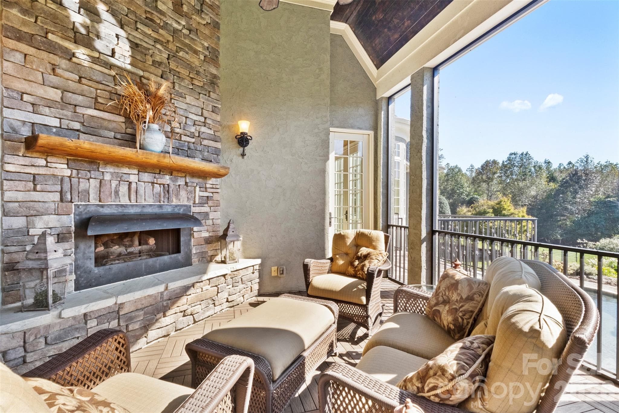 Screened porch off the hearth room and kitchen with propane fireplace and beautiful views - 973 Pinnacle Drive, Iron Station