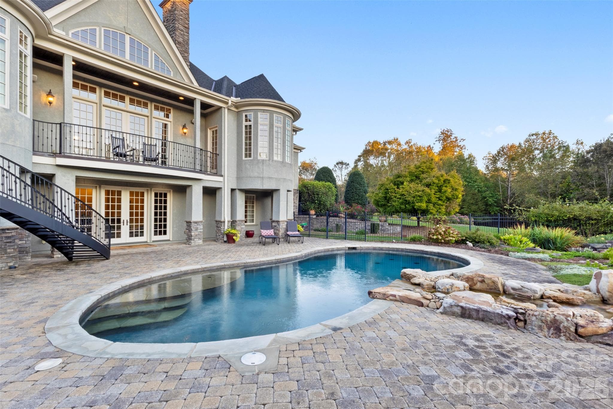 Paver terrace around the pool and seating areas - 973 Pinnacle Drive, Iron Station