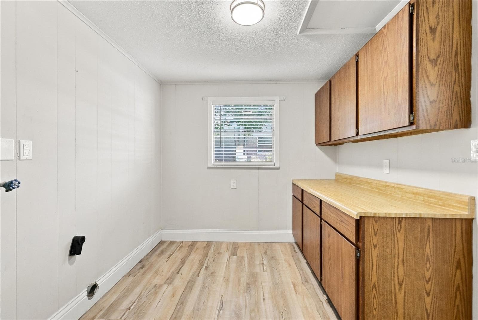 Inside utility with washer and dryer hookups. - 330 BROOKLYN AVE, ORANGE CITY