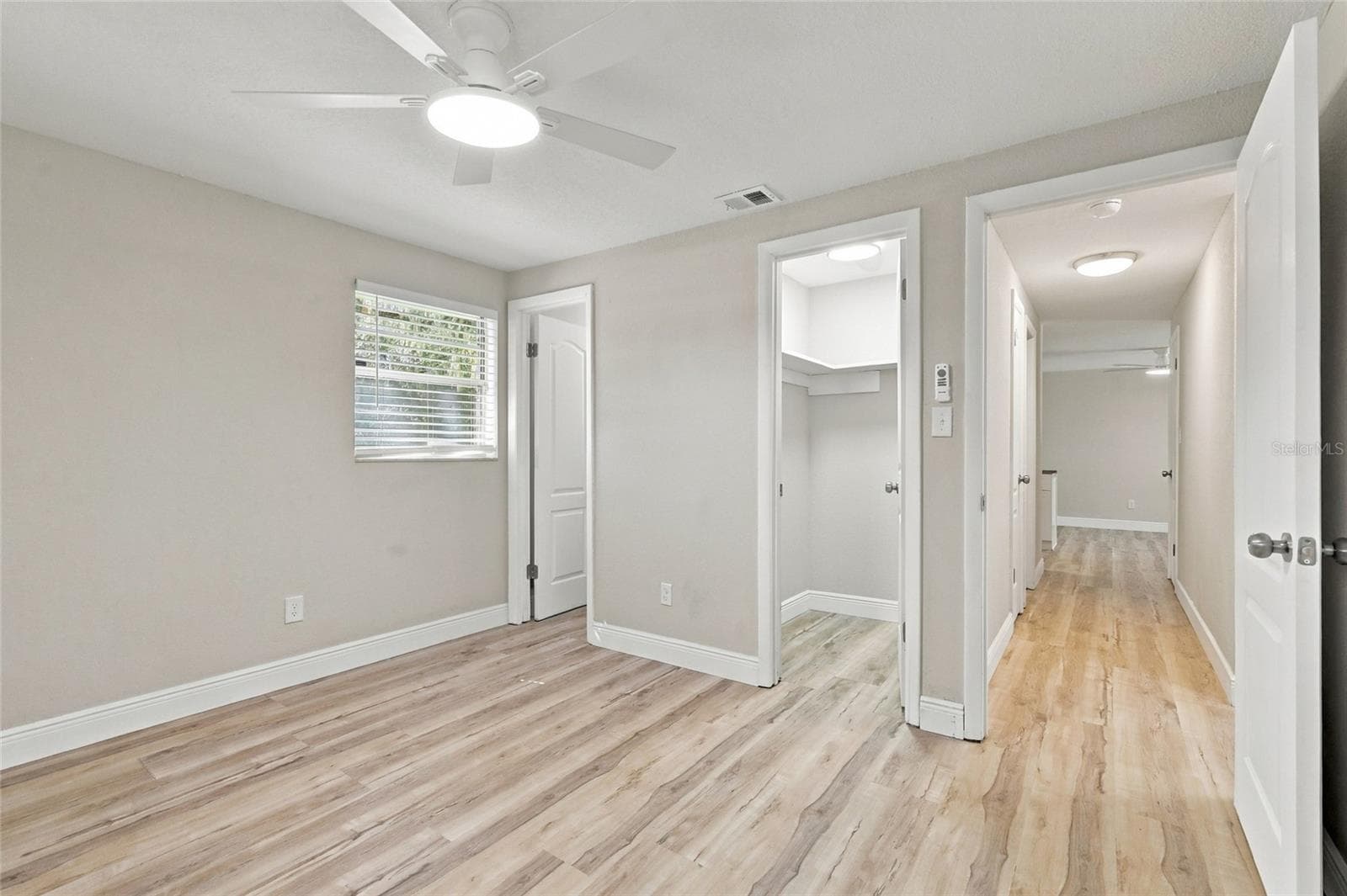 Primary bedroom with walk-in closet. - 330 BROOKLYN AVE, ORANGE CITY
