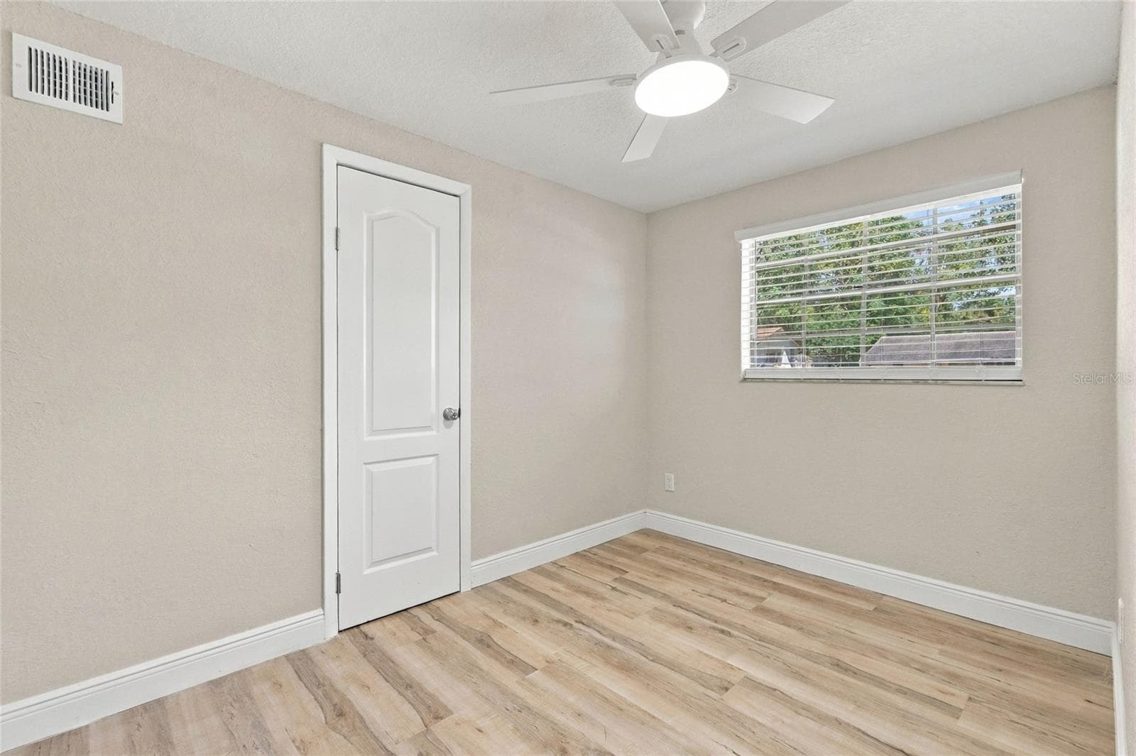 Second bedroom with closet door. - 330 BROOKLYN AVE, ORANGE CITY