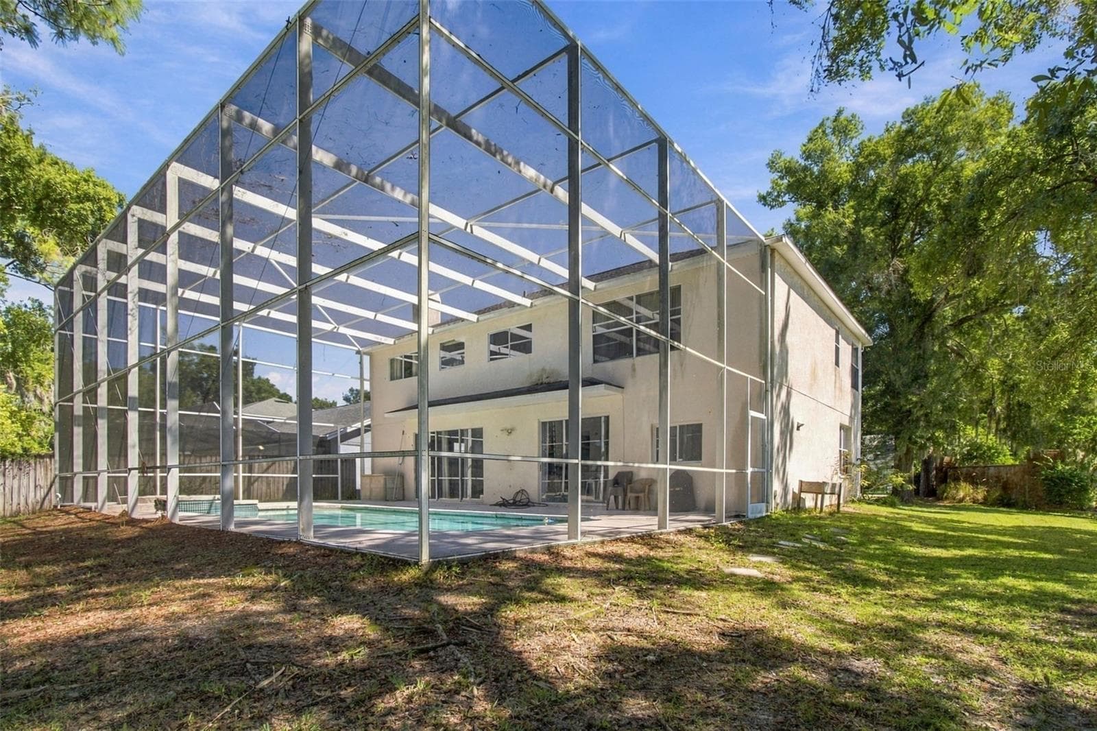 Screened in Patio Encompasses the house and pool - 8102 STONEFIELD, TAMPA