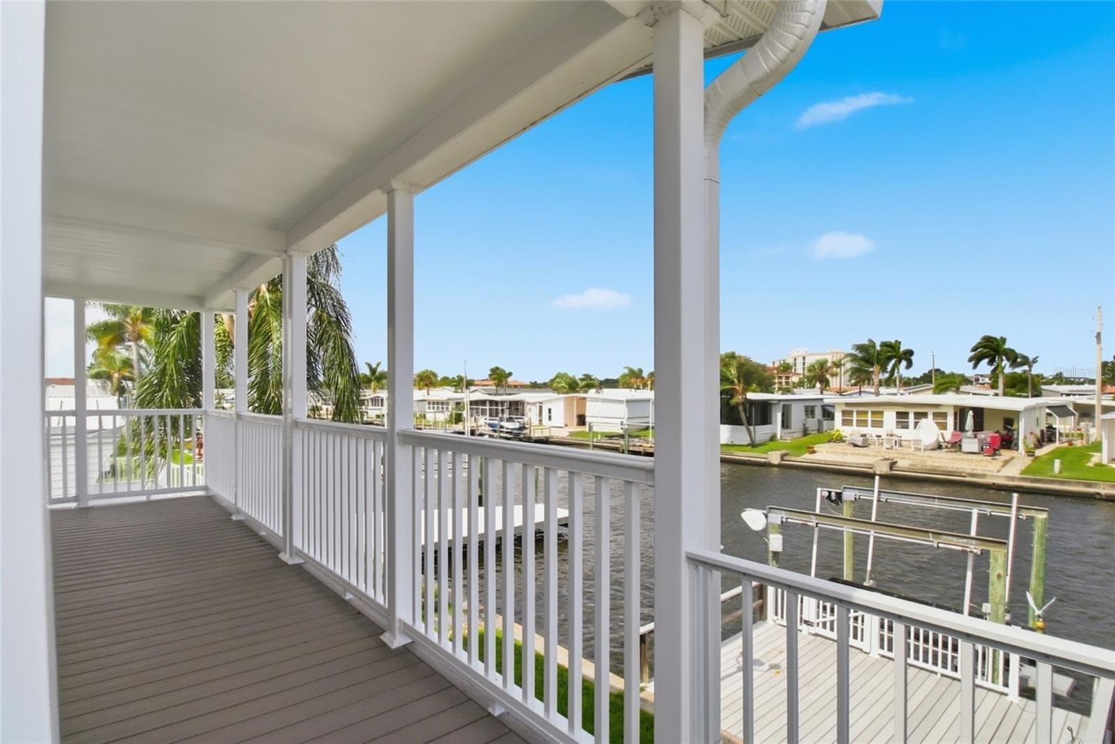 Expansive waterfront back patio overlooking large boat dock and lift - 18675 U.S. HIGHWAY 19 N. #349, CLEARWATER