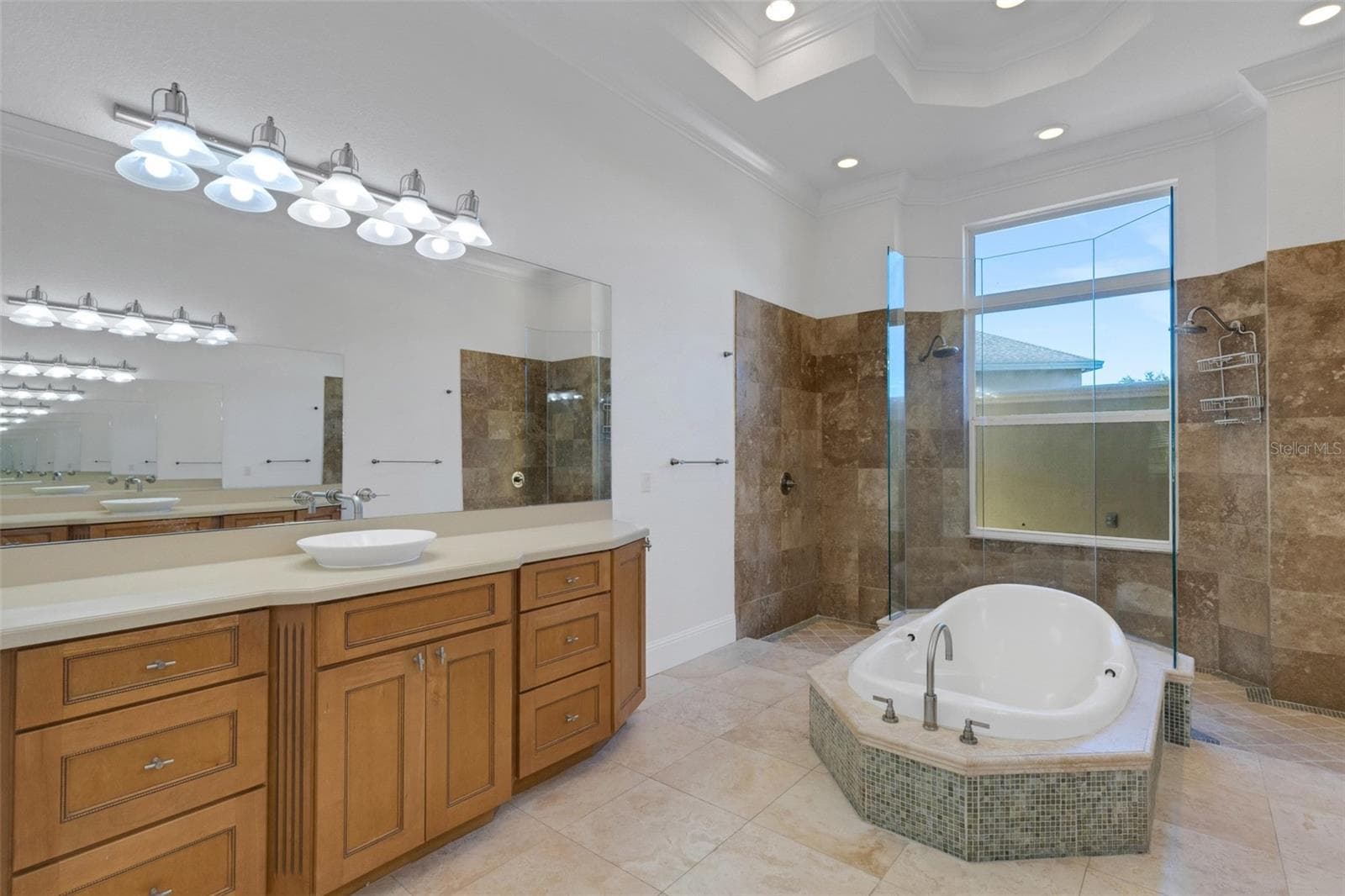The ensuite bathroom has dual long vanities with tons of storage. - 6562 EAGLE VIEW LOOP, LAKELAND