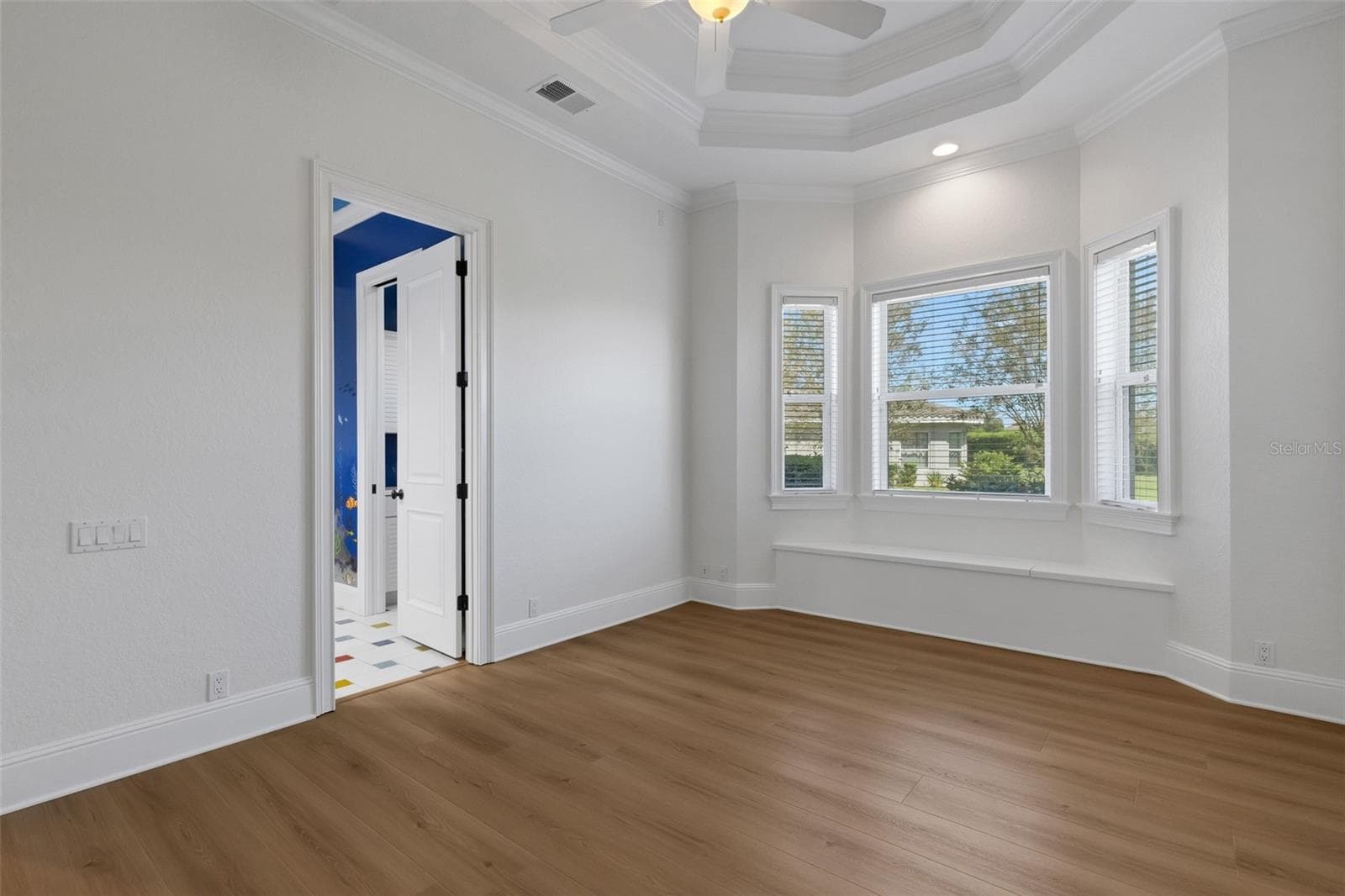 Bedroom# 3 also has the window seat storage and a giant walk-in closet that wraps under the stairs. - 6562 EAGLE VIEW LOOP, LAKELAND