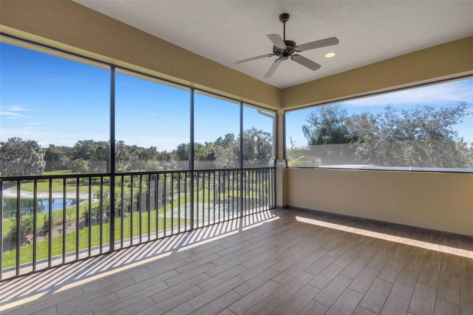 The screen enclosed balcony affords panoramic views that extend well beyond the backyard. - 6562 EAGLE VIEW LOOP, LAKELAND