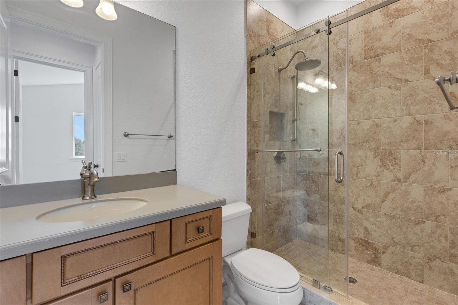 Bathroom# 4 has a fully tiled shower with European glass enclosure system. - 6562 EAGLE VIEW LOOP, LAKELAND