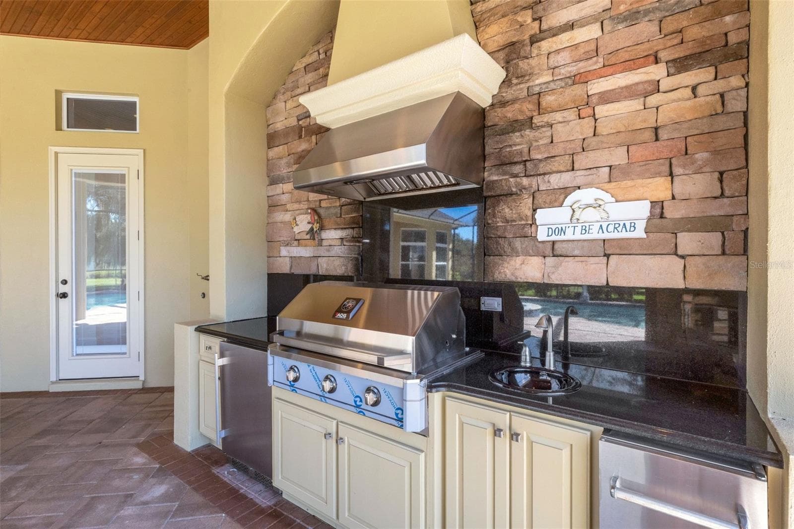 There NEW built-in gas grill, refrigerator and bar sink area. - 6562 EAGLE VIEW LOOP, LAKELAND