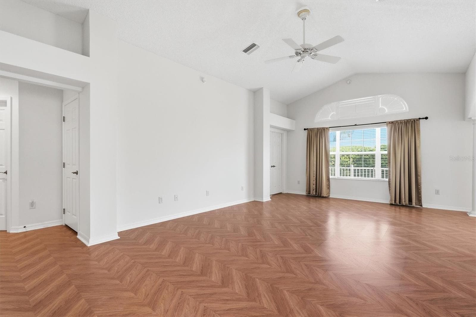 Living Room - Vaulted Ceilings with Herringbone Parquet Flooring. - 1563 EASTOVER TER, THE VILLAGES